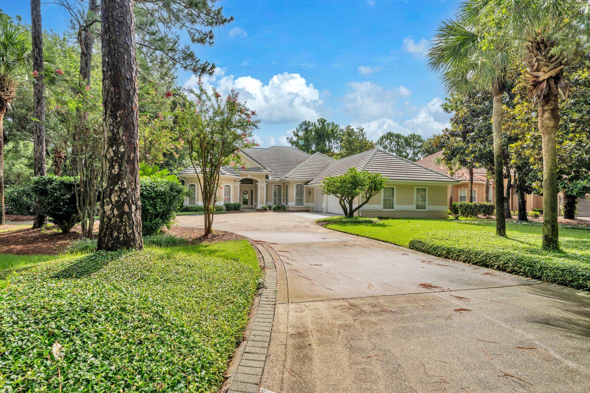 423 Maritime Court Destin, FL 32541 - Photo 2 of 39 a front view of a house with garden