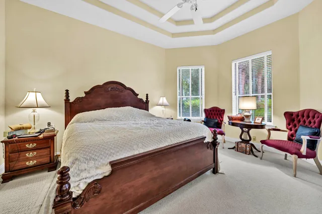 a bed room with a bed and a chair