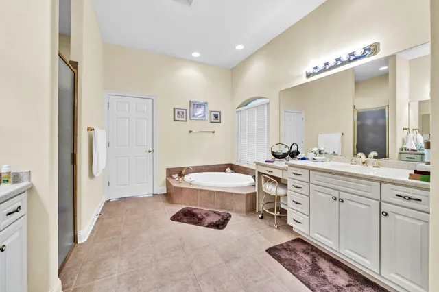 a bathroom with a sink mirror and toilet
