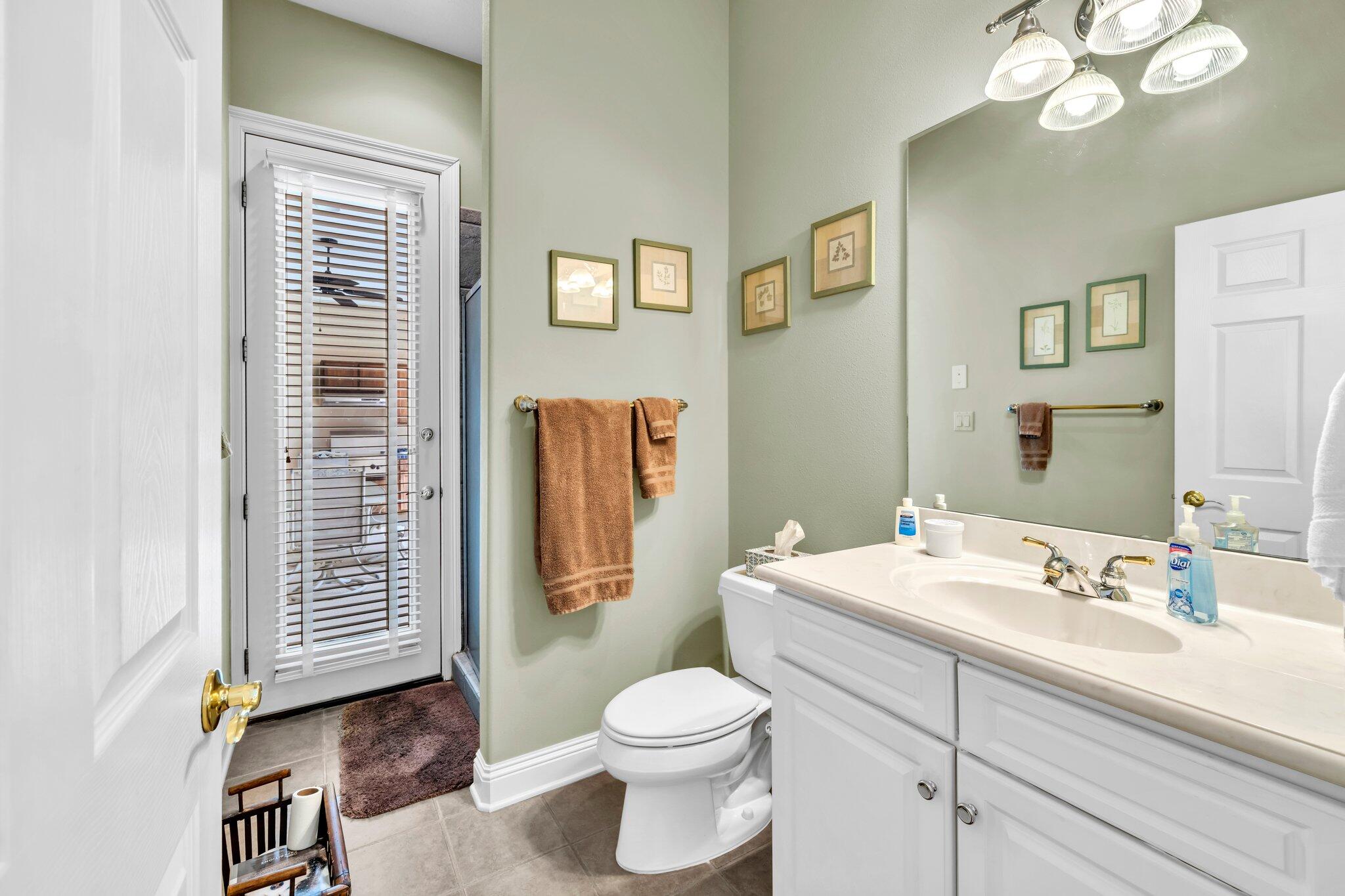 423 Maritime Court Destin, FL 32541 - Photo 29 of 39 a bathroom with a sink a toilet and shower