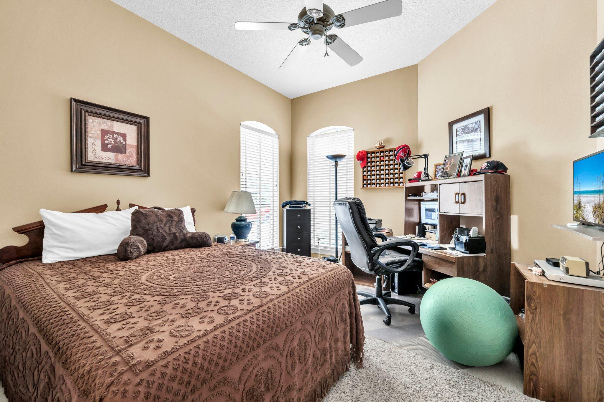 423 Maritime Court Destin, FL 32541 - Photo 31 of 39 a bedroom with bed and a large window