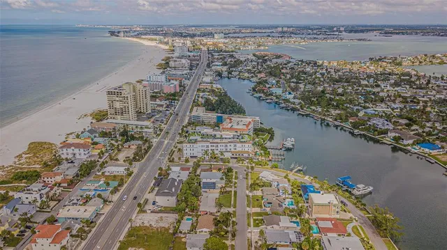 a kitchen with stainless steel appliances granite countertop a refrigerator sink and stove