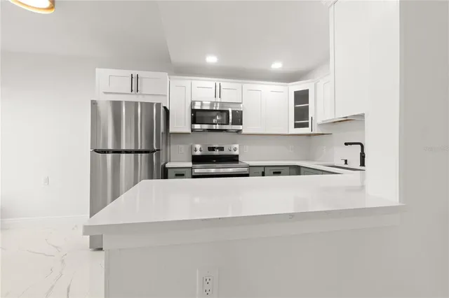 a view of room with window and ceiling fan