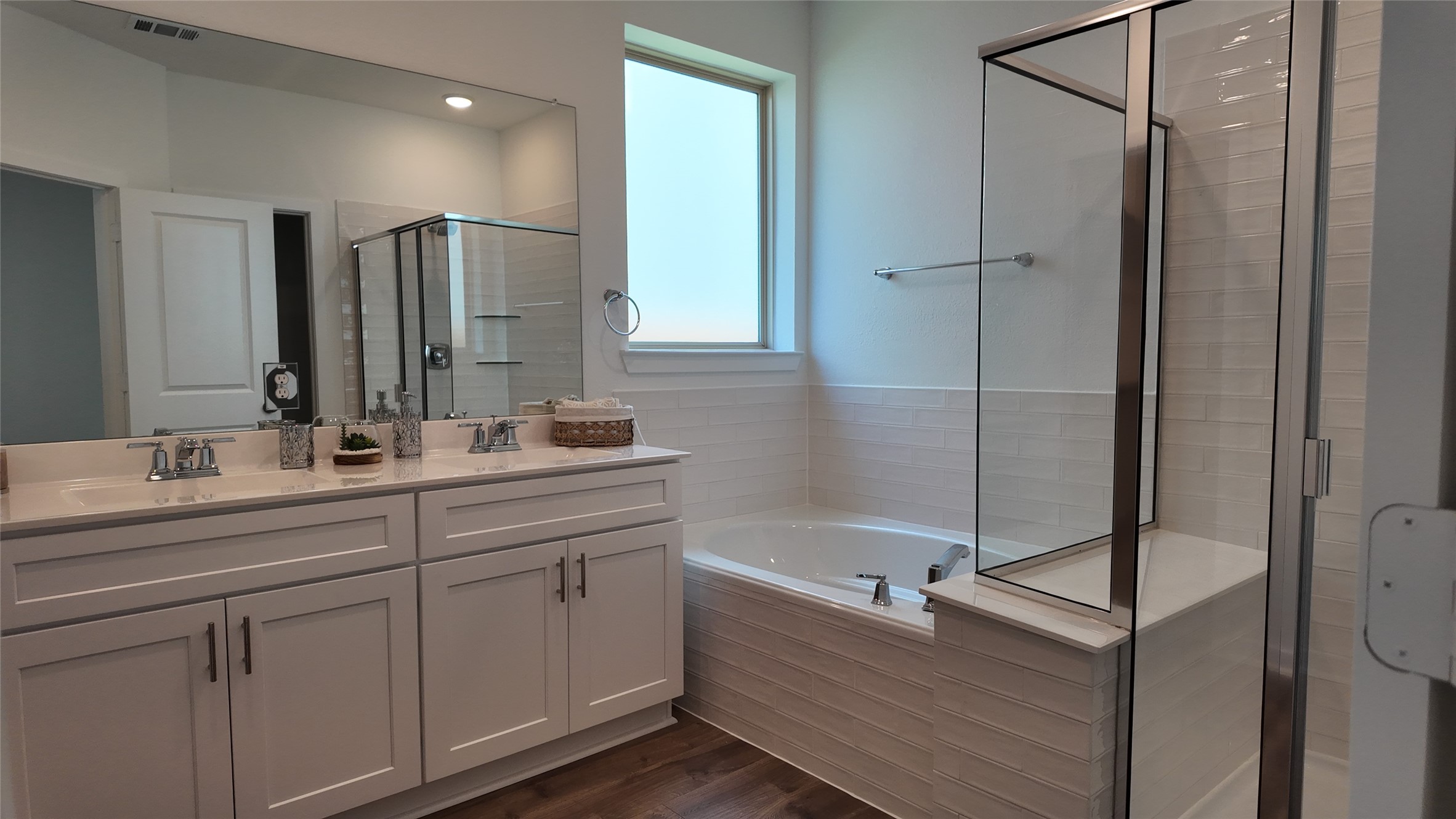 15645 Wandering Maple Way Conroe, TX 77302 - Photo 11 of 14 a bathroom with a double vanity sink mirror and bathtub