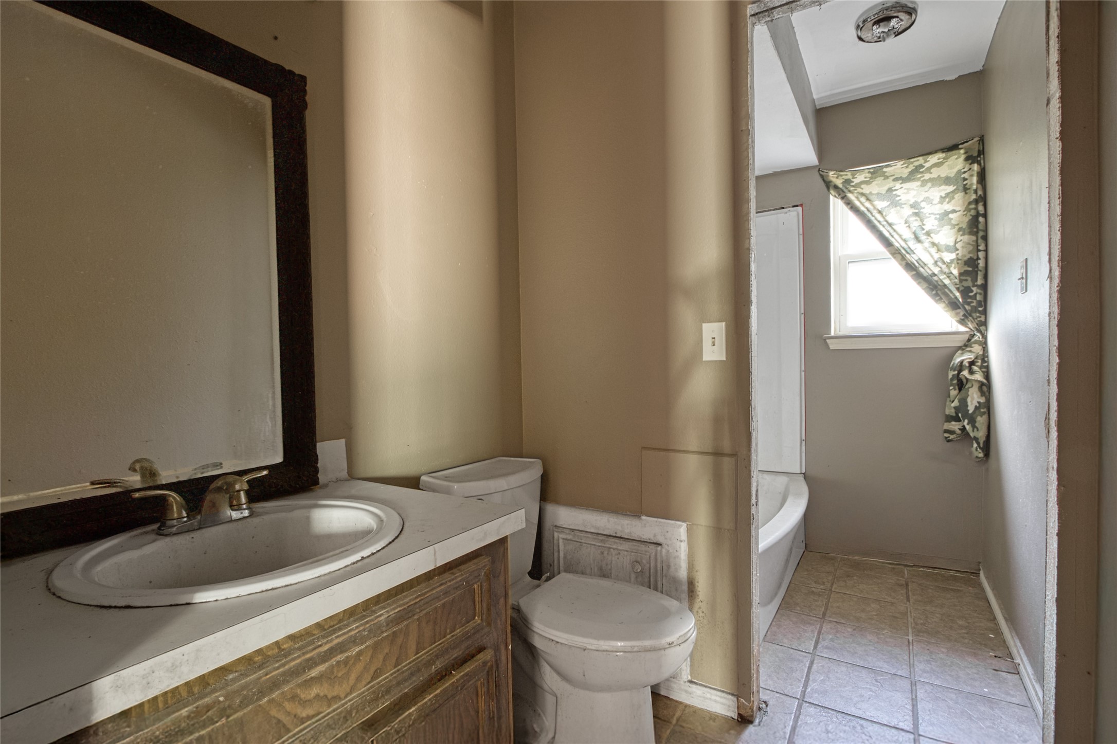 40015 Gable Circle Magnolia, TX 77354 - Photo 12 of 19 a bathroom with a granite countertop sink toilet and mirror