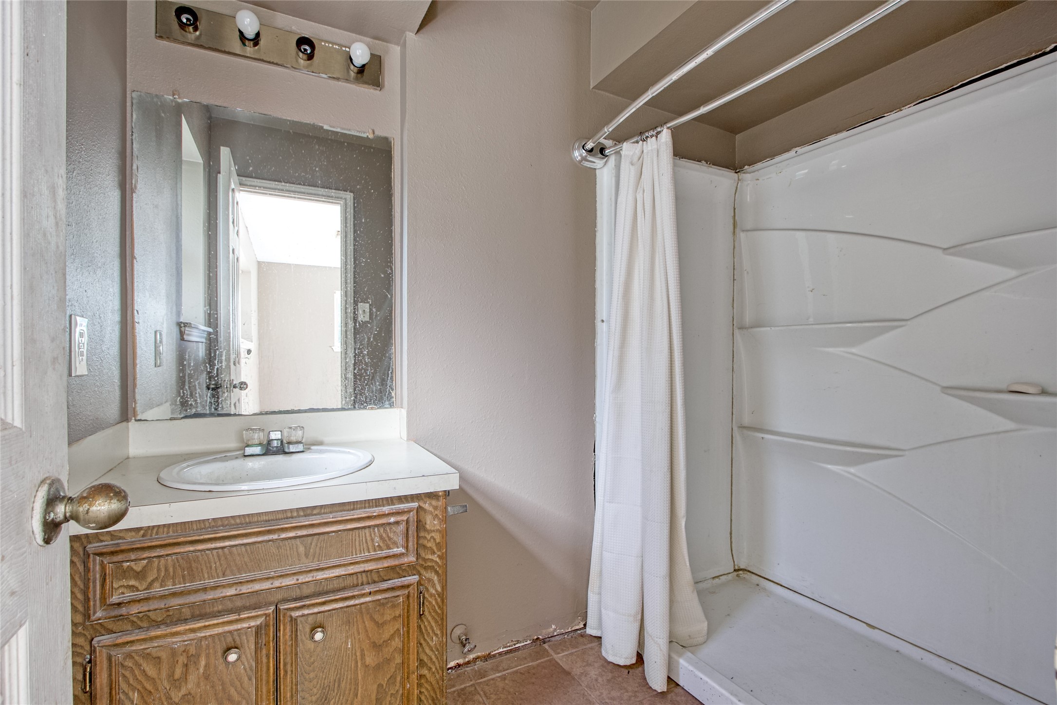 40015 Gable Circle Magnolia, TX 77354 - Photo 15 of 19 a bathroom with a sink a vanity and a mirror