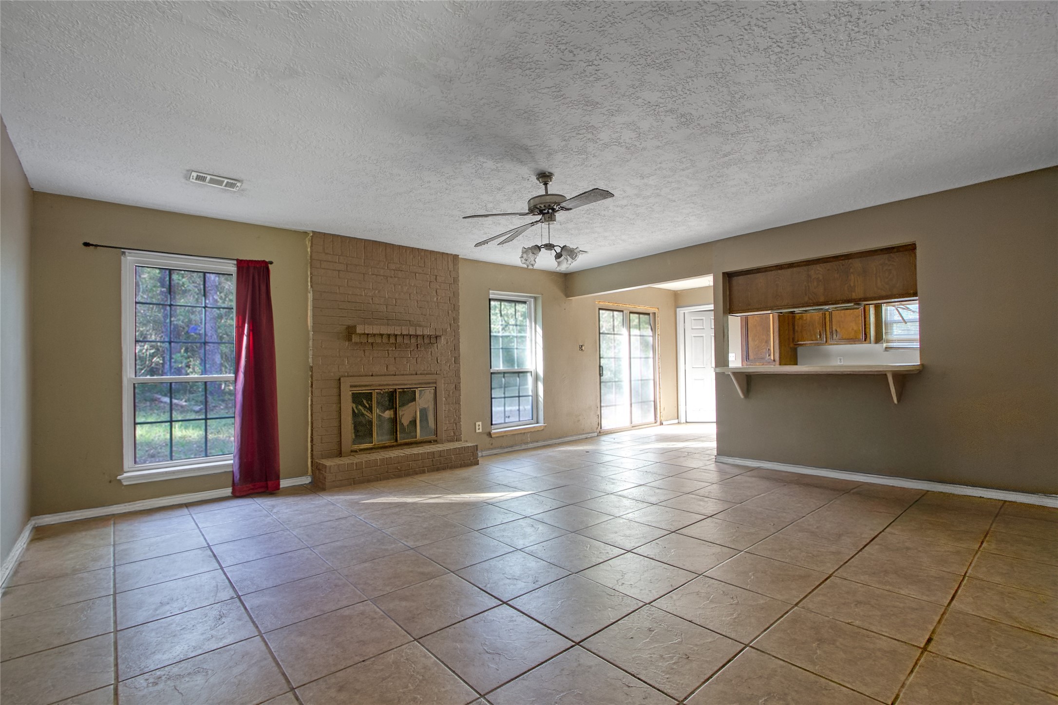 40015 Gable Circle Magnolia, TX 77354 - Photo 6 of 19 a view of an empty room with a fireplace and a window