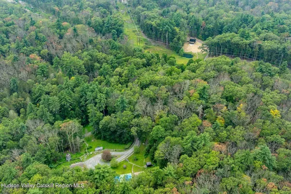 a kitchen with a sink dining table and chairs