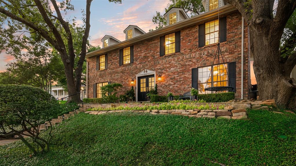 9315 Moss Cir Drive Dallas, TX 75243 - Photo 1 of 36 a front view of a house with a yard