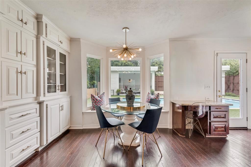 9315 Moss Cir Drive Dallas, TX 75243 - Photo 13 of 36 a view of a dining room with furniture window and wooden floor