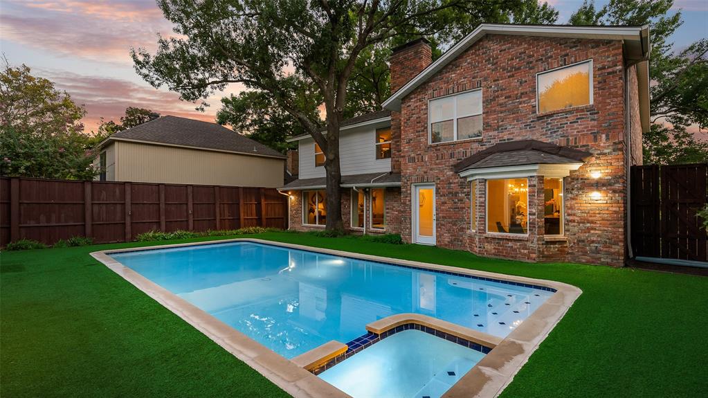 9315 Moss Cir Drive Dallas, TX 75243 - Photo 2 of 36 a view of a house with pool and a yard in front of it