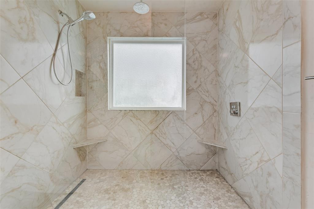 9315 Moss Cir Drive Dallas, TX 75243 - Photo 22 of 36 a bathroom with a shower
