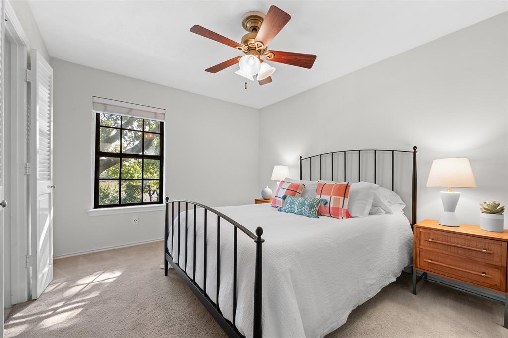 9315 Moss Cir Drive Dallas, TX 75243 - Photo 23 of 36 a bedroom with bed and a window