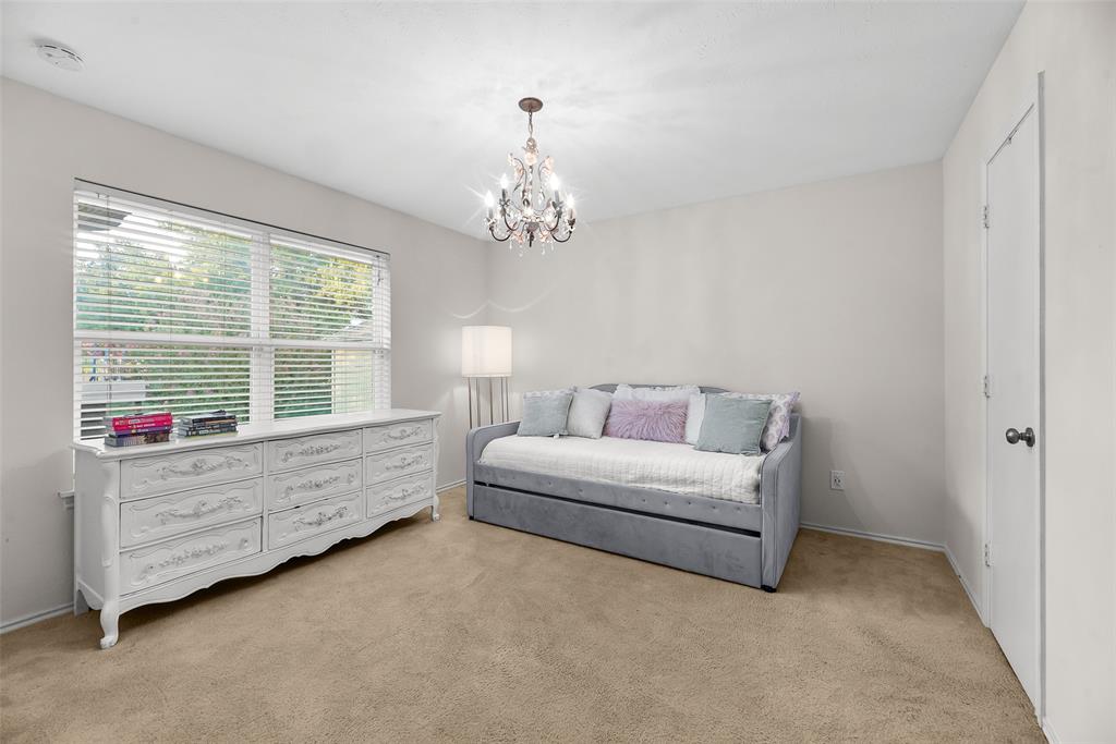9315 Moss Cir Drive Dallas, TX 75243 - Photo 28 of 36 a living room with furniture and windows