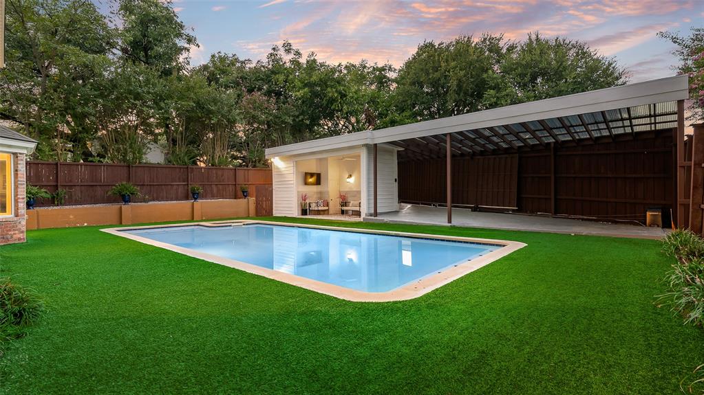 9315 Moss Cir Drive Dallas, TX 75243 - Photo 3 of 36 a view of a backyard with a small pool and wooden fence