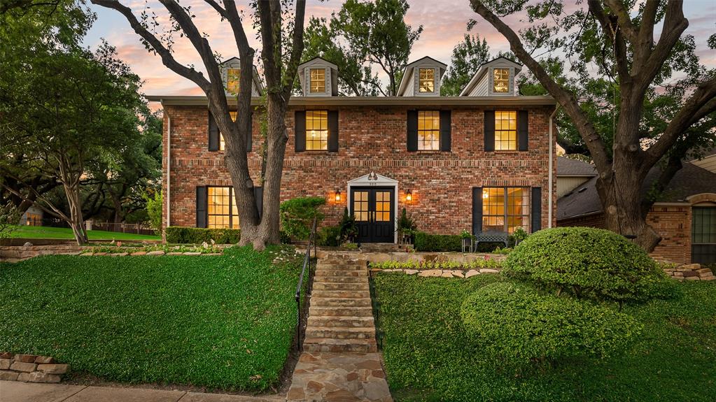 9315 Moss Cir Drive Dallas, TX 75243 - Photo 32 of 36 a front view of a house with a yard
