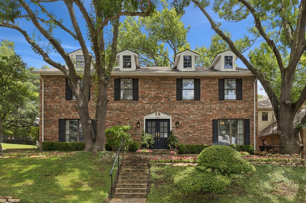 9315 Moss Cir Drive Dallas, TX 75243 - Photo 35 of 36 a front view of a house with a garden