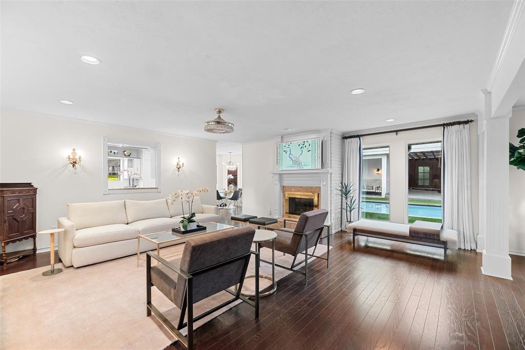 9315 Moss Cir Drive Dallas, TX 75243 - Photo 7 of 36 a living room with furniture and a fireplace