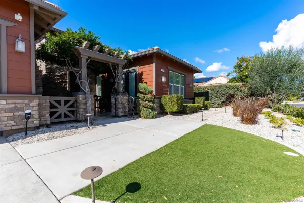 a front view of a house with garden