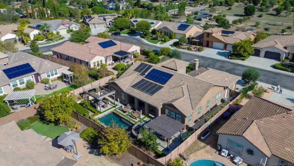 an aerial view of a house with a garden