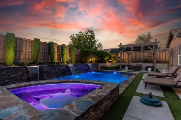 a view of swimming pool with outdoor seating