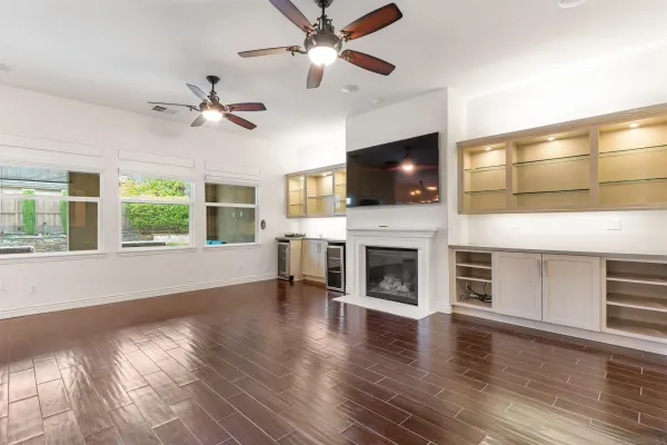 a living room with fireplace furniture and a flat screen tv