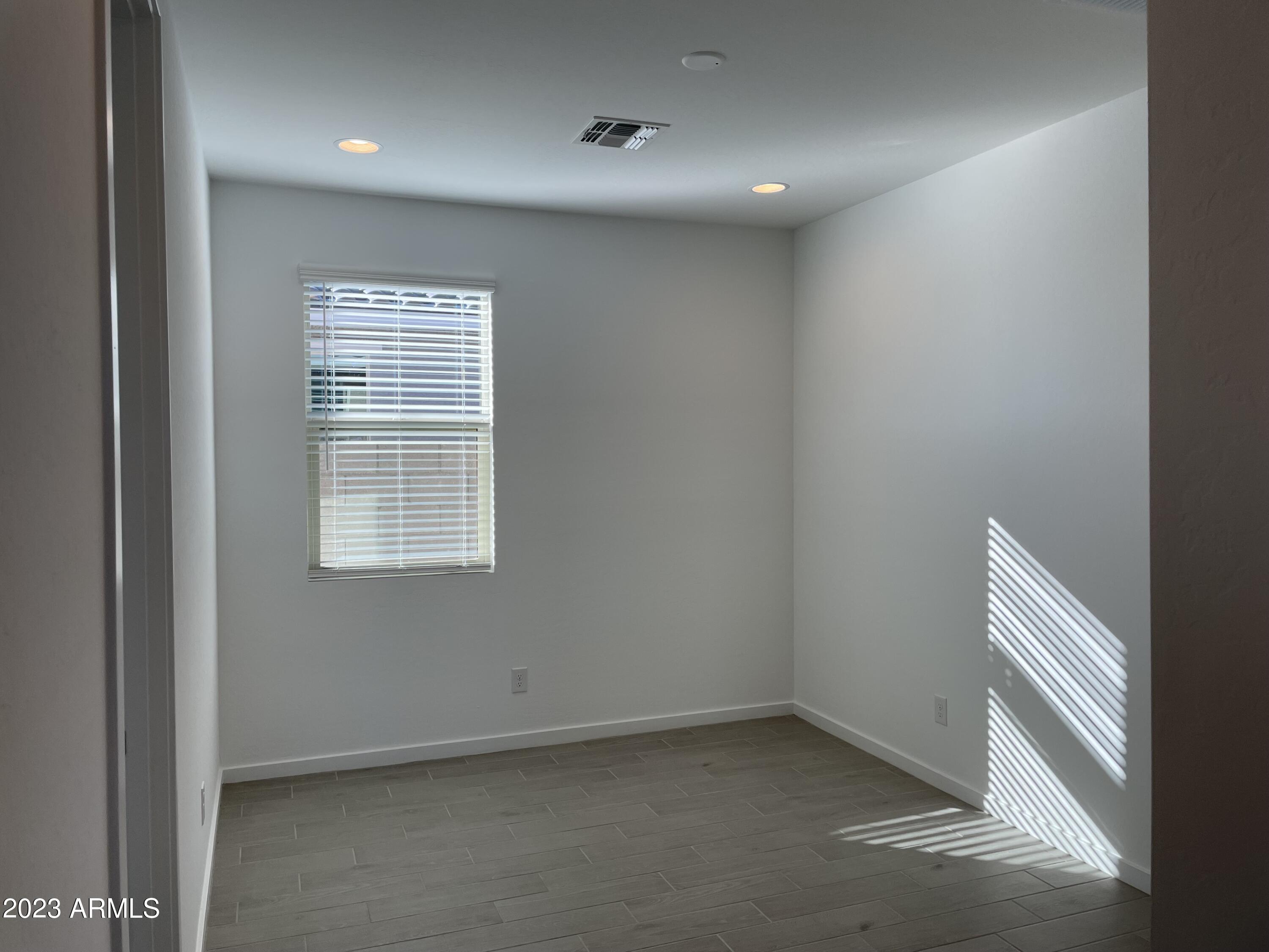 17401 West Red Fox Road Surprise, AZ 85387 - Photo 17 of 41 an empty room with a window