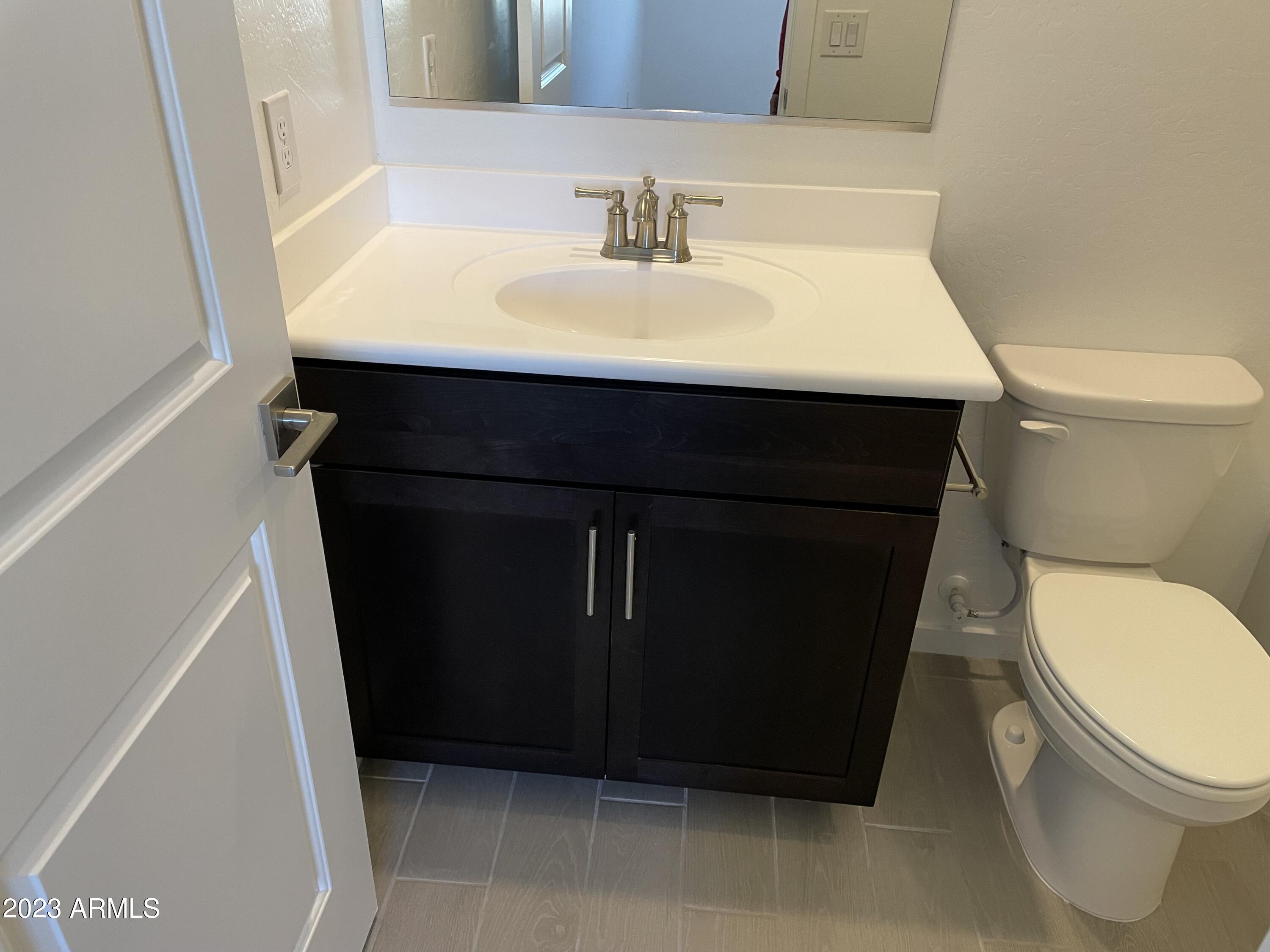 17401 West Red Fox Road Surprise, AZ 85387 - Photo 29 of 41 a bathroom with a sink and a toilet