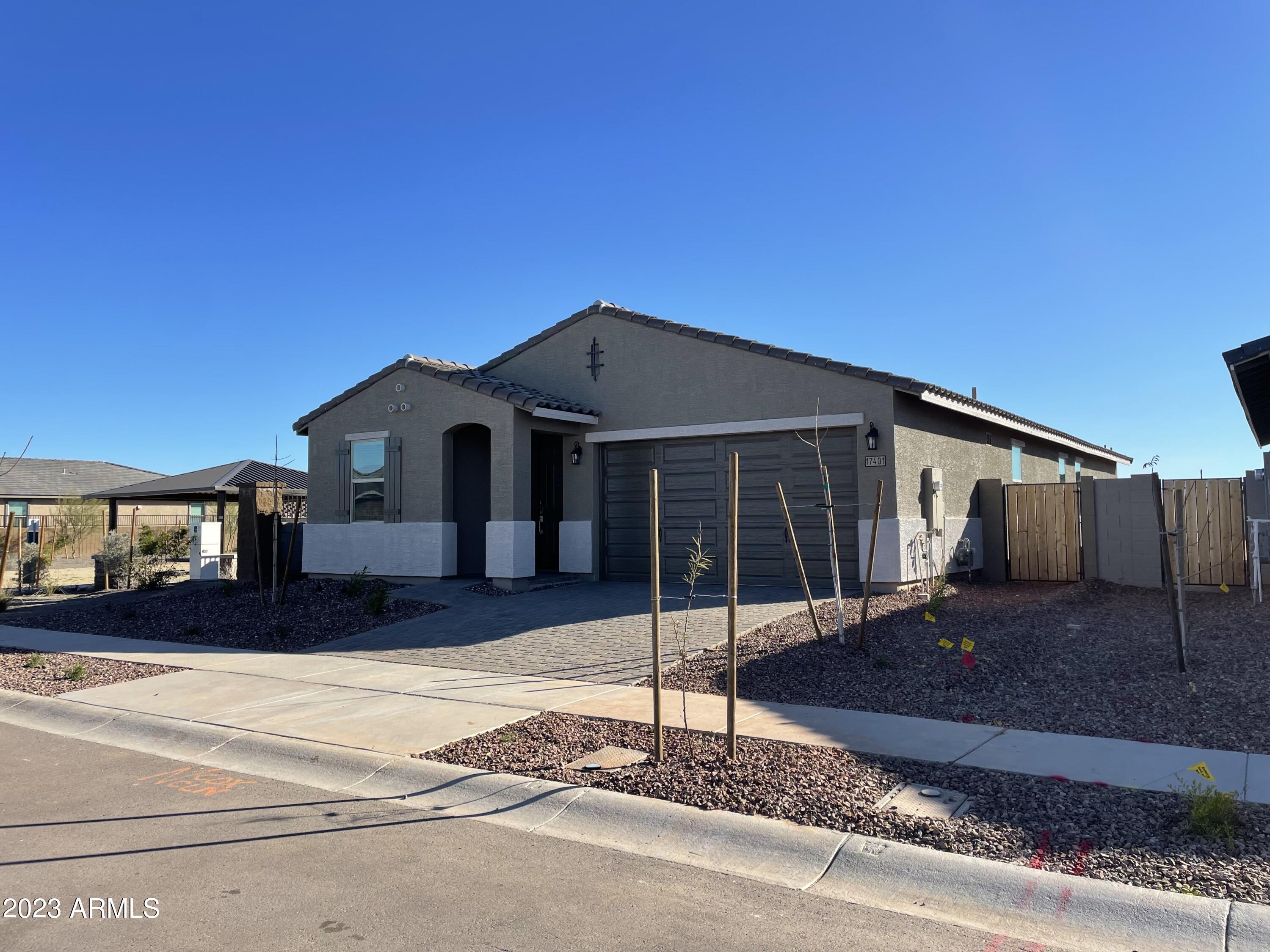 17401 West Red Fox Road Surprise, AZ 85387 - Photo 4 of 41 a front view of a house with a porch