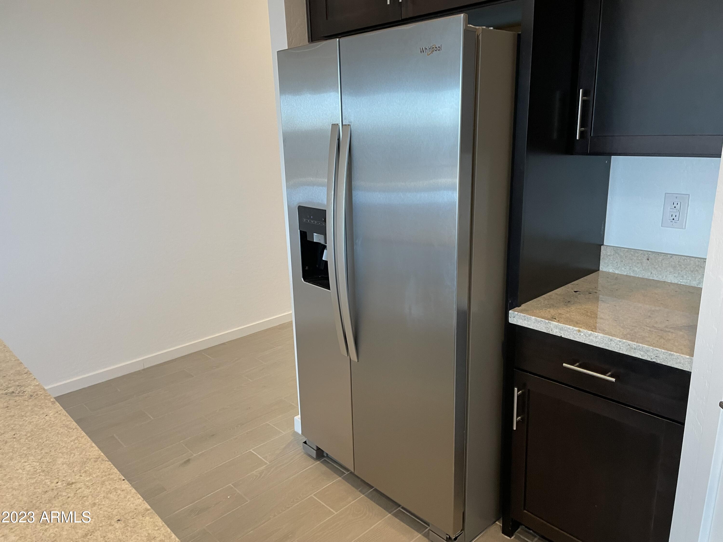 17401 West Red Fox Road Surprise, AZ 85387 - Photo 8 of 41 a view of a kitchen from the hallway