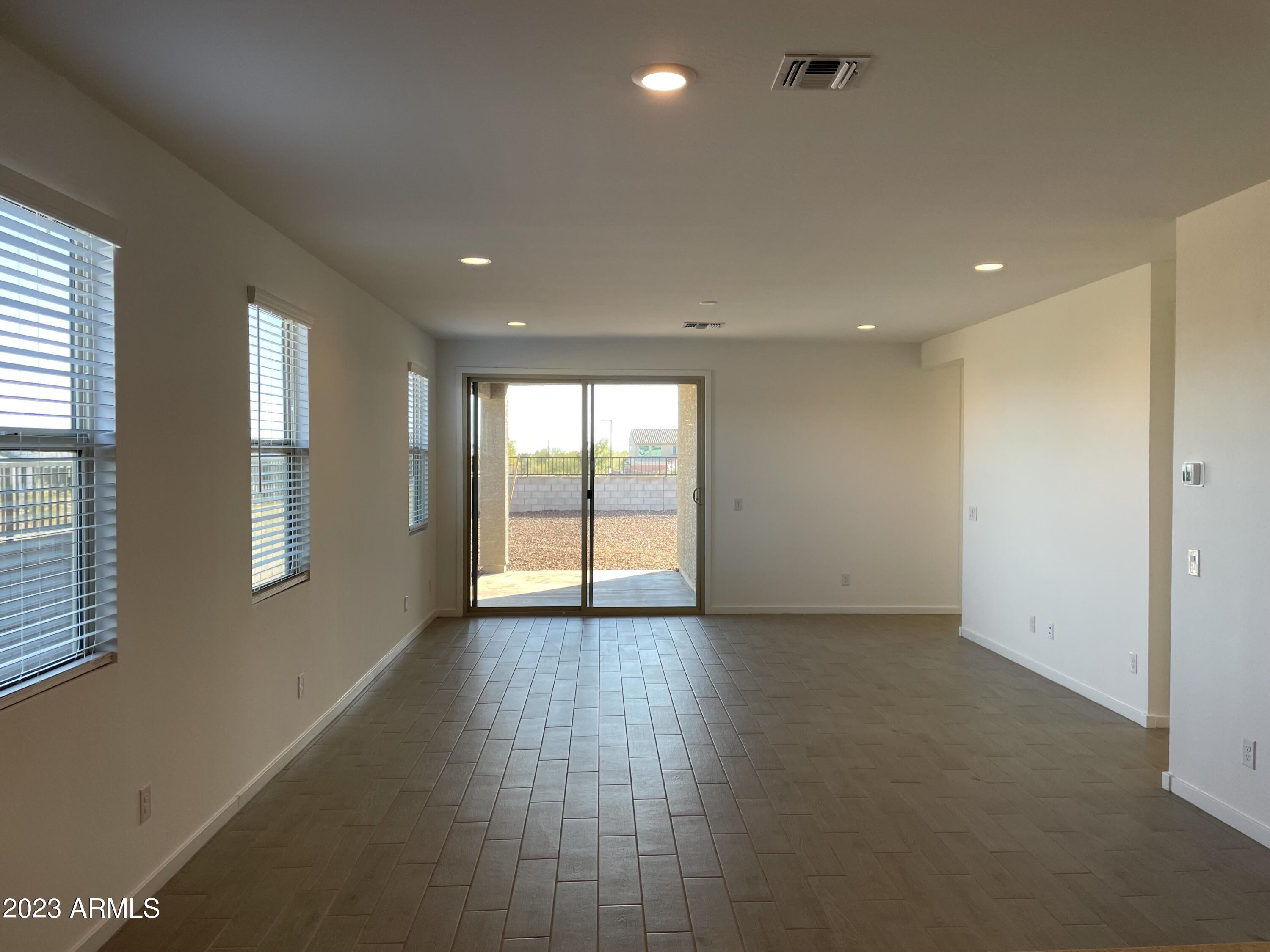 17401 West Red Fox Road Surprise, AZ 85387 - Photo 9 of 41 a view of an empty room with a window