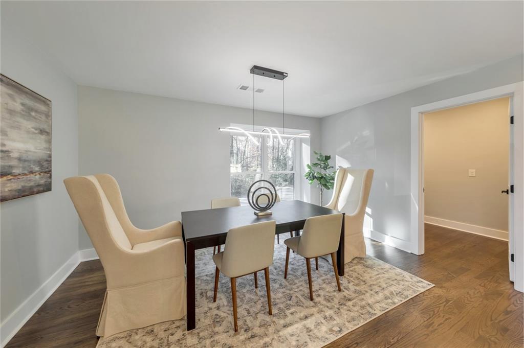 2066 Old Forge Way Marietta, GA 30068 - Photo 20 of 54 a view of a dining room with furniture and chandelier
