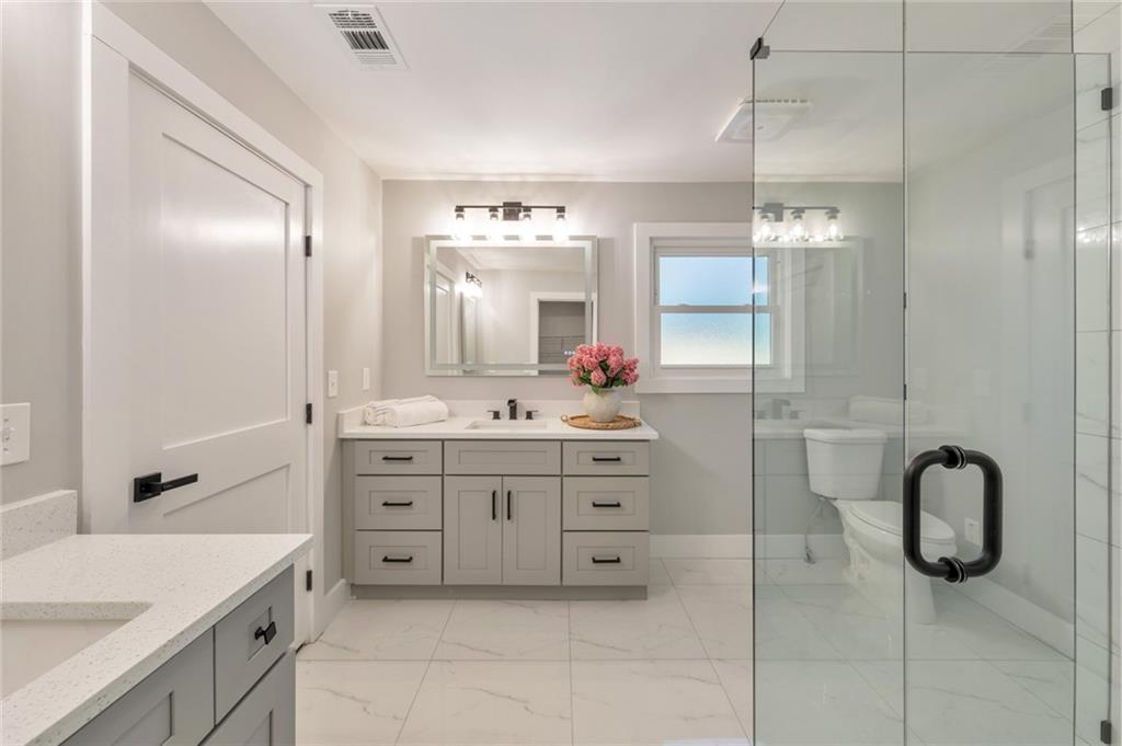 2066 Old Forge Way Marietta, GA 30068 - Photo 25 of 54 a bathroom with a granite countertop sink mirror and double