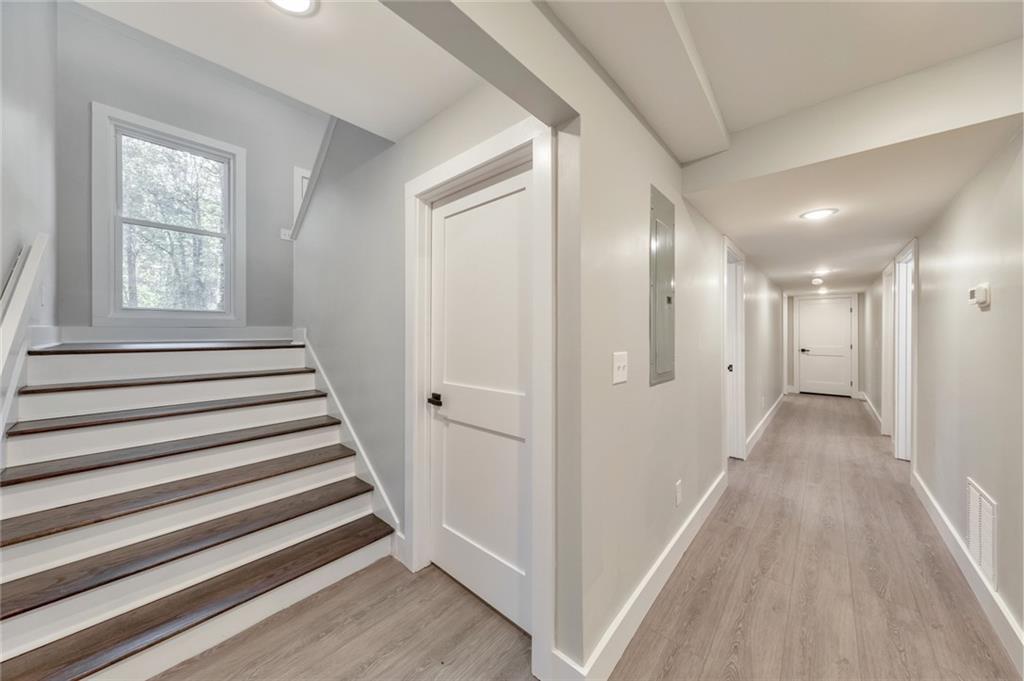 2066 Old Forge Way Marietta, GA 30068 - Photo 31 of 54 a view of a hallway with wooden floor and entryway