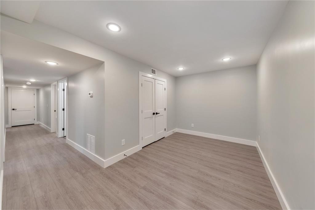 2066 Old Forge Way Marietta, GA 30068 - Photo 32 of 54 a view of an empty room with wooden floor