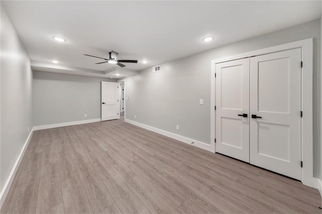 2066 Old Forge Way Marietta, GA 30068 - Photo 39 of 54 a view of an empty room with a ceiling fan