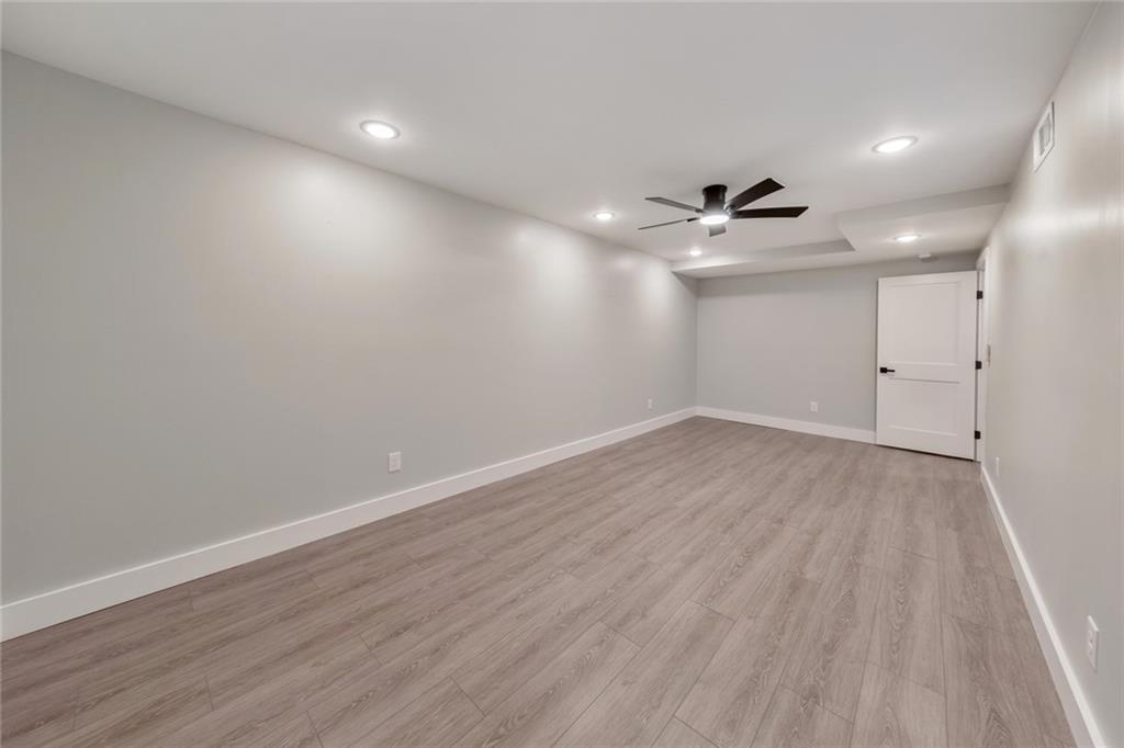 2066 Old Forge Way Marietta, GA 30068 - Photo 40 of 54 wooden floor in an empty room with a window