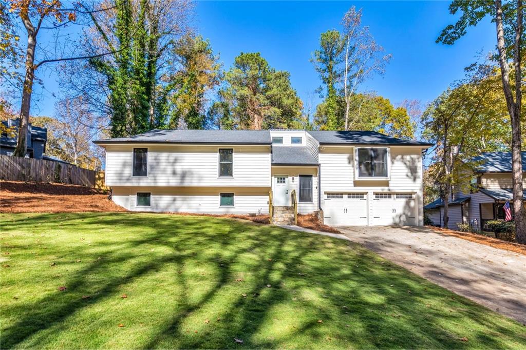 2066 Old Forge Way Marietta, GA 30068 - Photo 45 of 54 a house view with a sitting space and garden