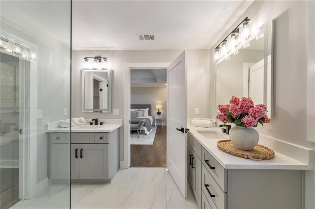 2066 Old Forge Way Marietta, GA 30068 - Photo 5 of 54 a bathroom with a sink vanity and mirror