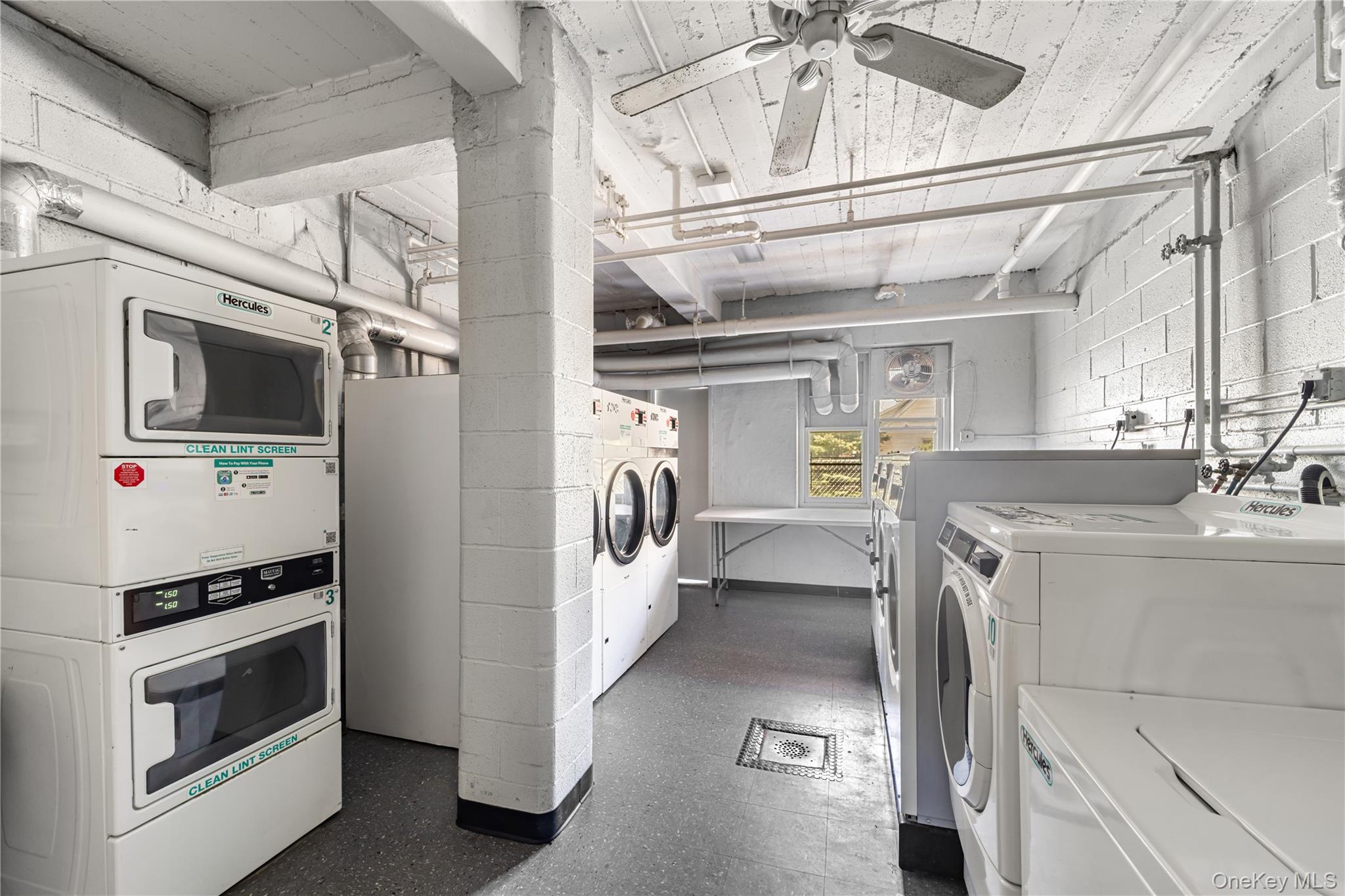 600 Locust Street, Unit 3G Mount Vernon, NY 10552 - Photo 23 of 25 a utility room with a stove a washer and dryer