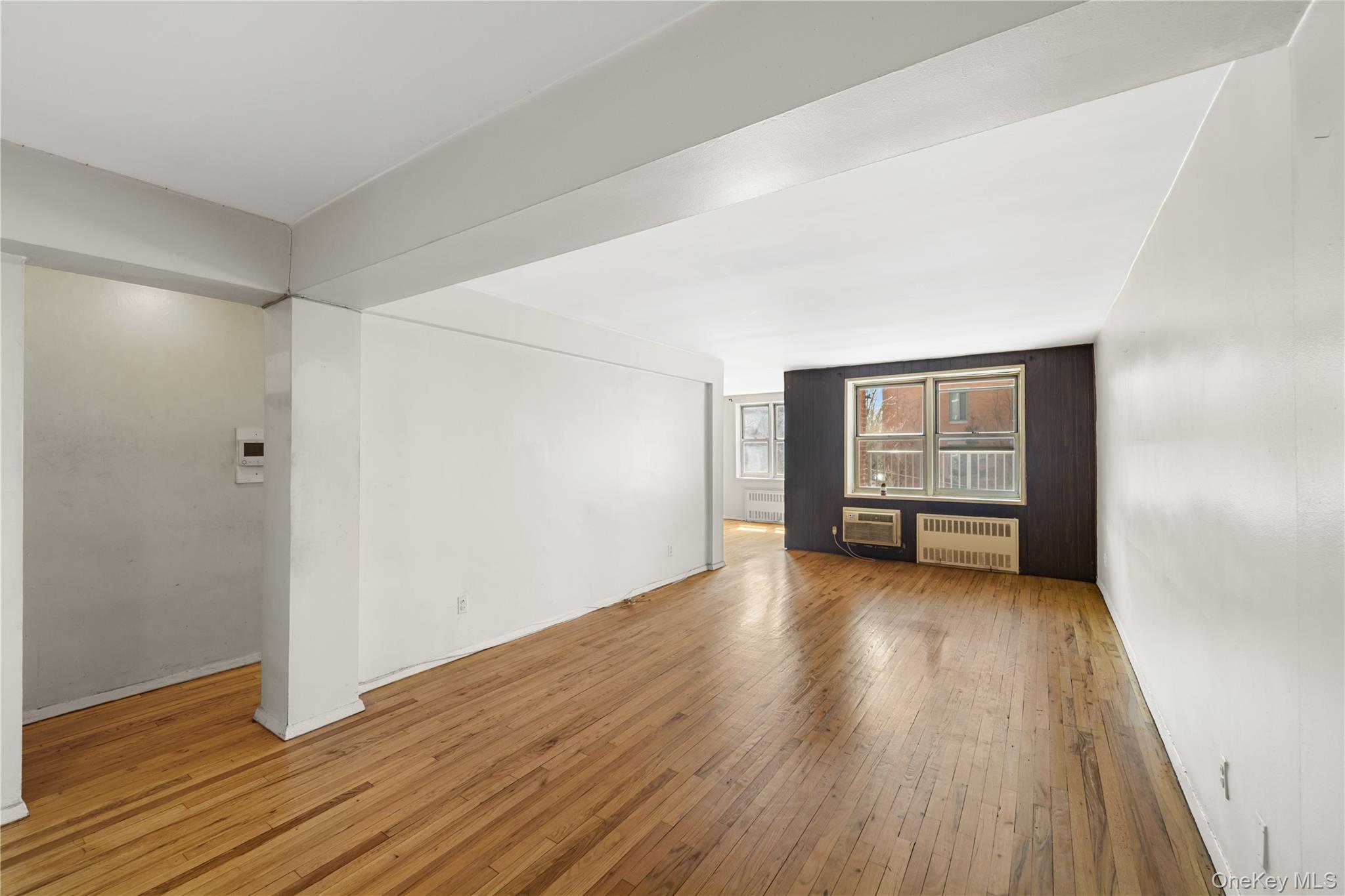 600 Locust Street, Unit 3G Mount Vernon, NY 10552 - Photo 5 of 25 wooden floor in an empty room