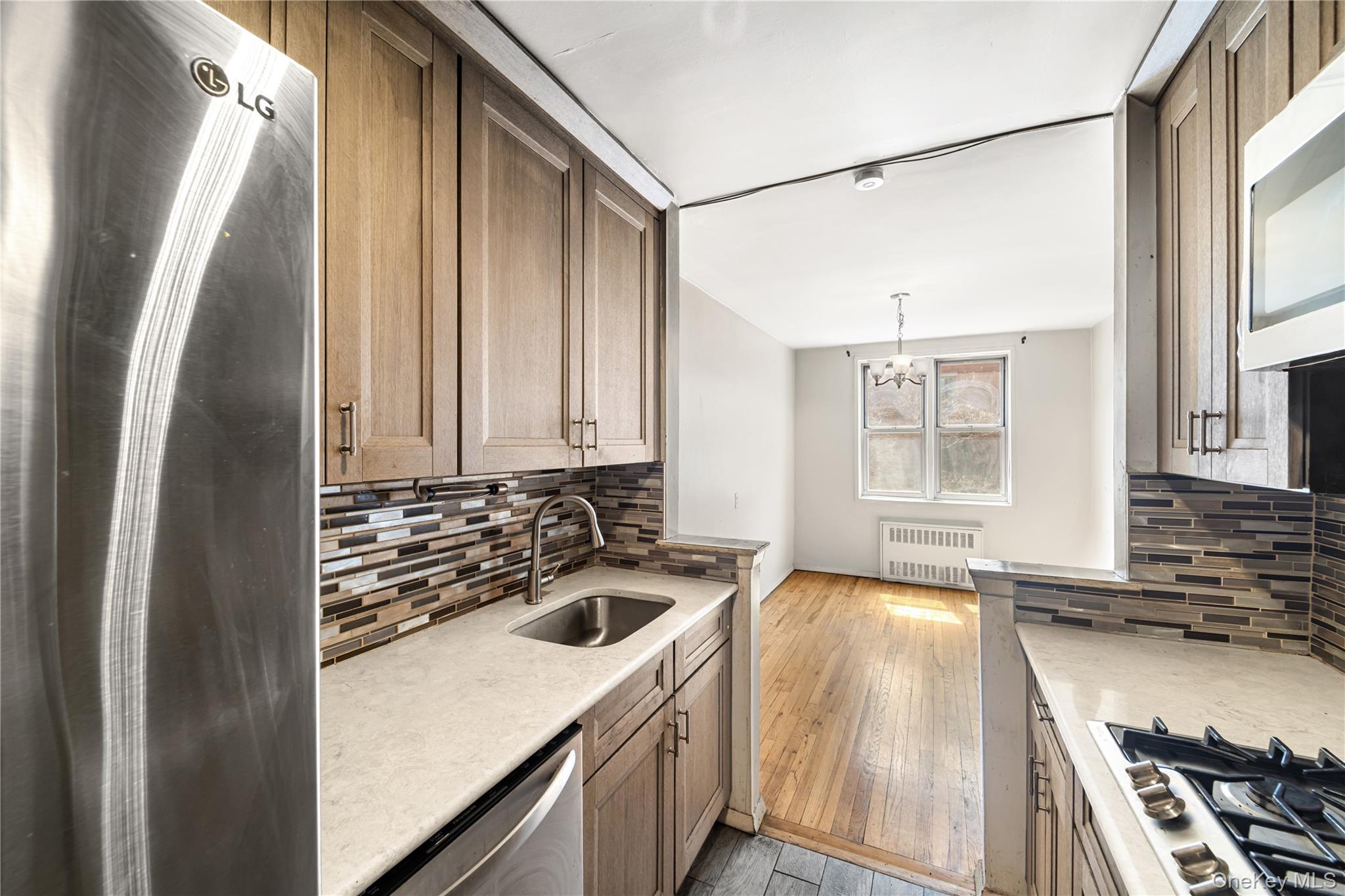 600 Locust Street, Unit 3G Mount Vernon, NY 10552 - Photo 7 of 25 a kitchen with a sink and a stove top oven