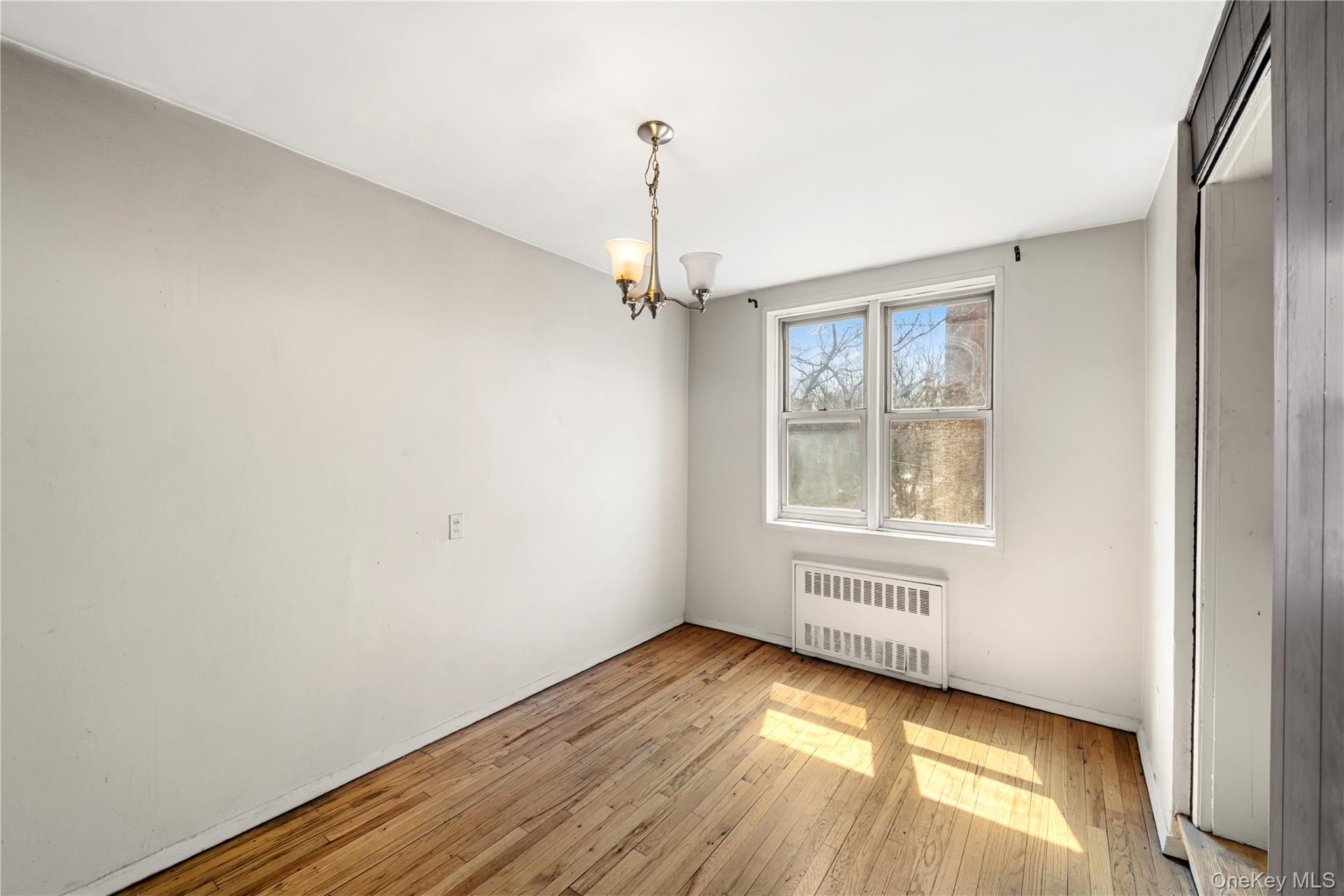600 Locust Street, Unit 3G Mount Vernon, NY 10552 - Photo 9 of 25 a view of a room with wooden floor staircase and windows
