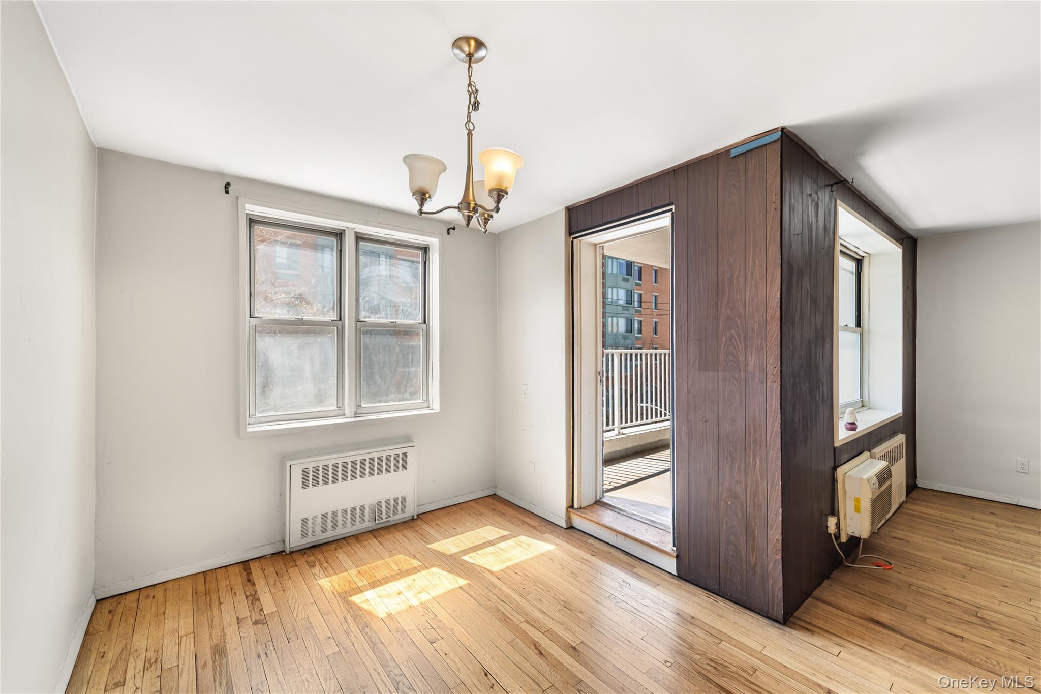 600 Locust Street, Unit 3G Mount Vernon, NY 10552 - Photo 10 of 25 a view of an empty room with wooden floor and a window