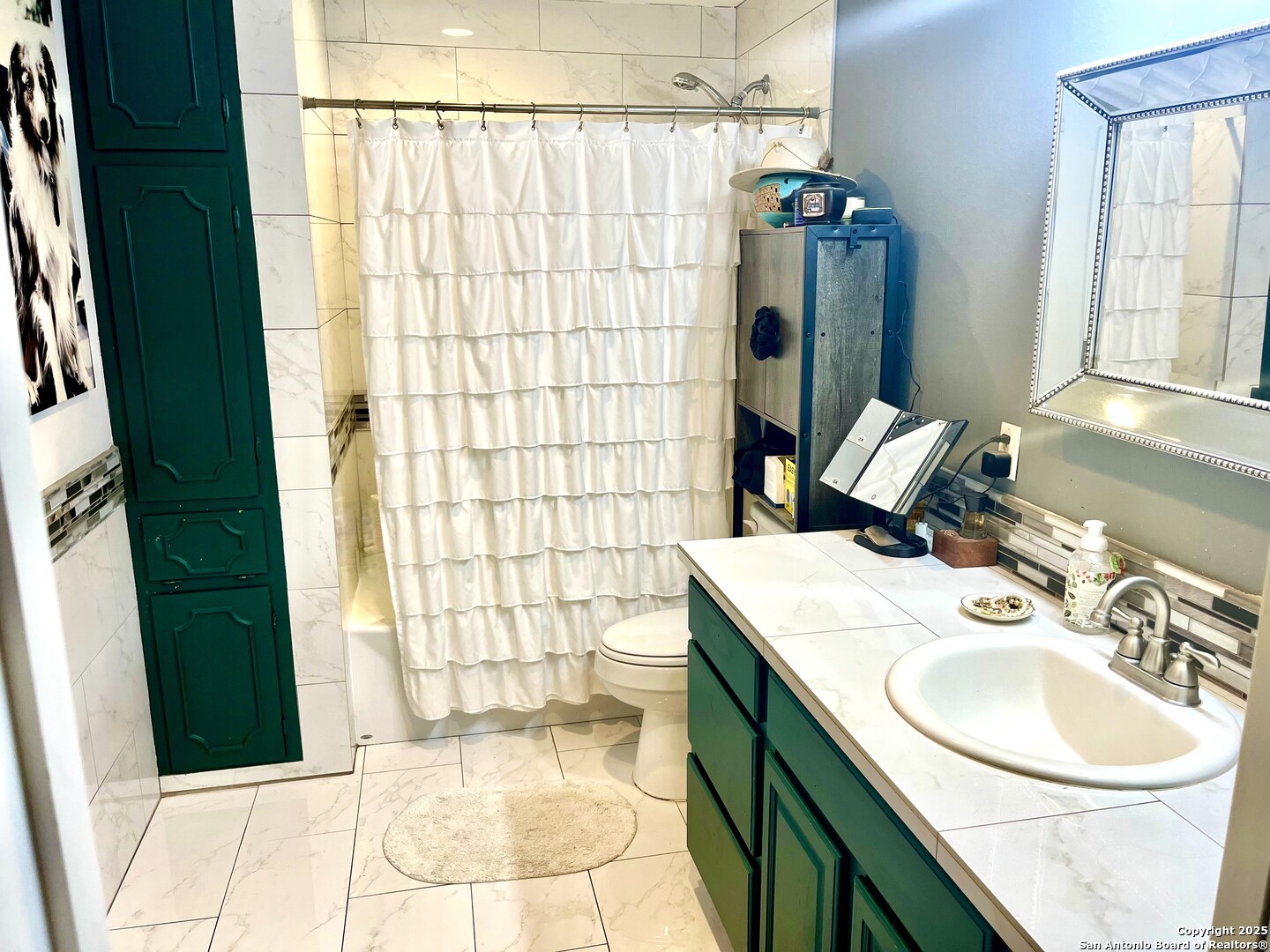 175 Columbus Street McDade, TX 78650 - Photo 14 of 23 a bathroom with a sink a toilet and shower
