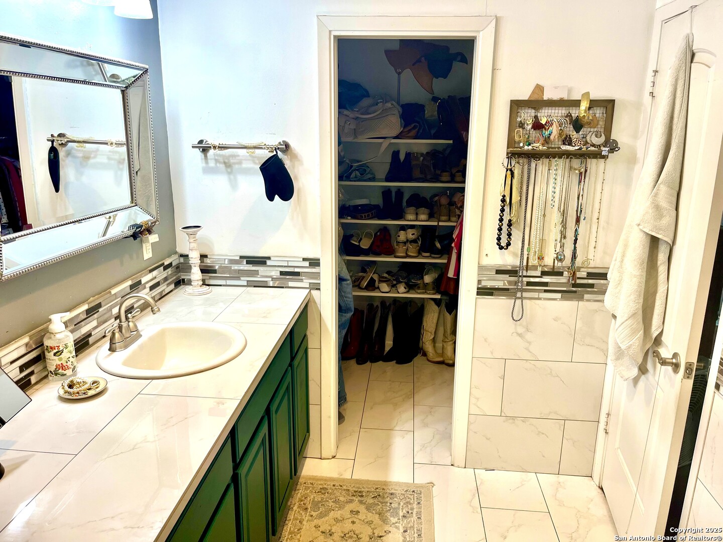 175 Columbus Street McDade, TX 78650 - Photo 15 of 23 a bathroom with a sink a toilet and shower