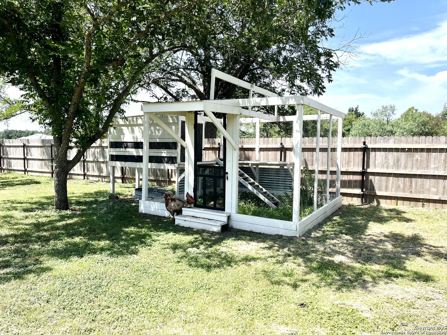 175 Columbus Street McDade, TX 78650 - Photo 21 of 23 a view of a house with a yard balcony and tree