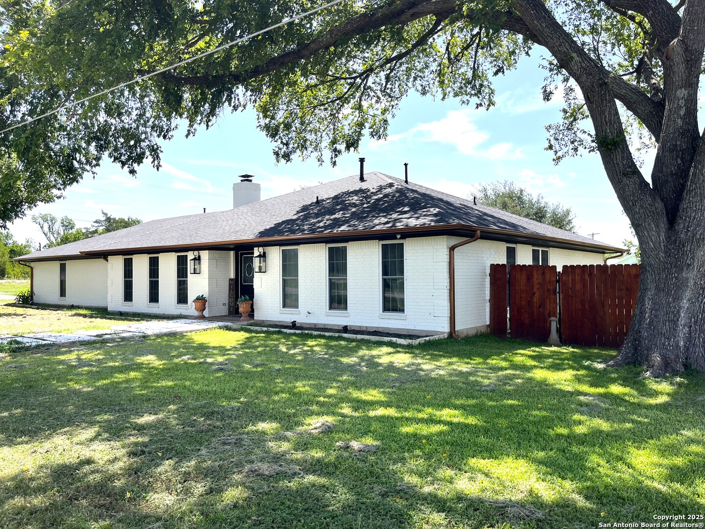 175 Columbus Street McDade, TX 78650 - Photo 3 of 23 a view of a house with a yard