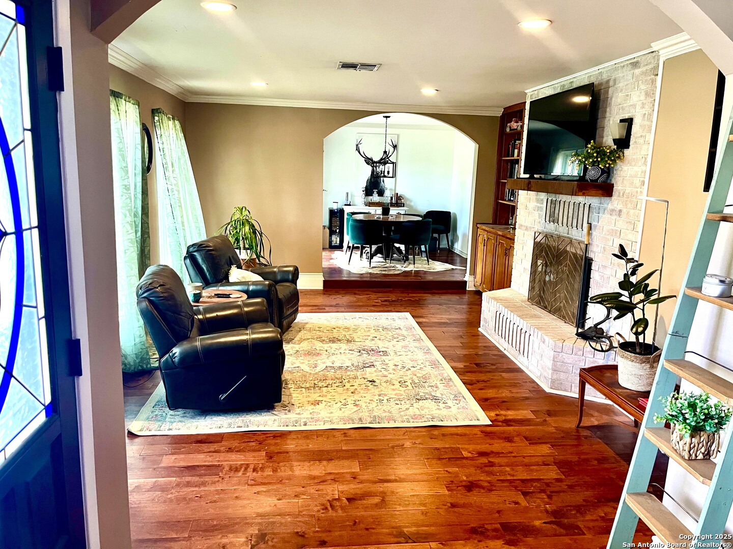 175 Columbus Street McDade, TX 78650 - Photo 5 of 23 a living room with fireplace furniture and a flat screen tv