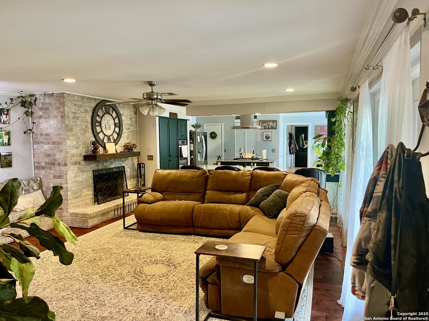 175 Columbus Street McDade, TX 78650 - Photo 10 of 23 a living room with furniture a fireplace and a flat screen tv